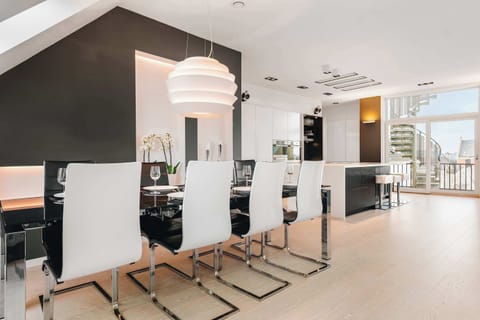 Open-concept kitchen and dining space, showcasing a bright and airy feel.
