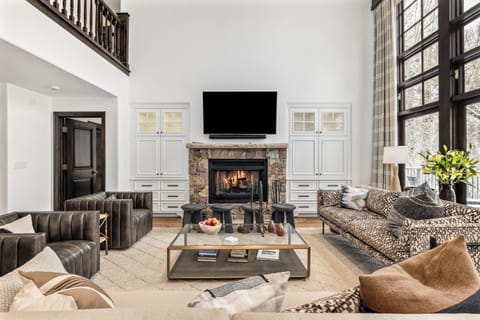 Great Room with floor to ceiling windows, slope views - Wood Burning Fireplace
