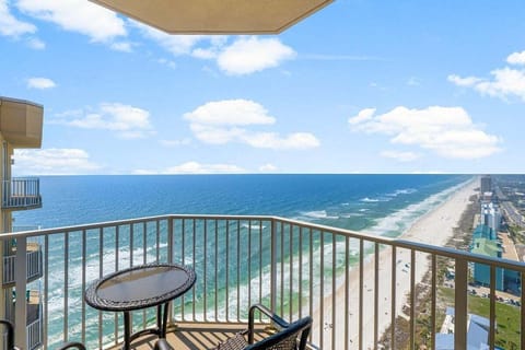 Step onto the private balcony, where comfortable chairs and loungers invite you to relax and take in the endless horizon.