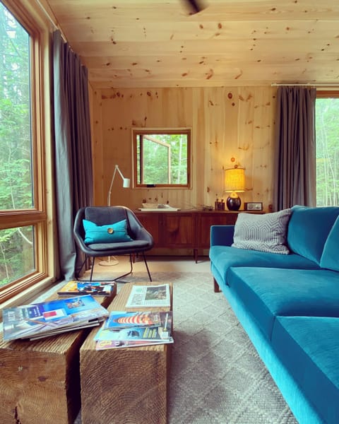 Plush sofa in sitting area. Front row view towards the Benjamin River Harbor.