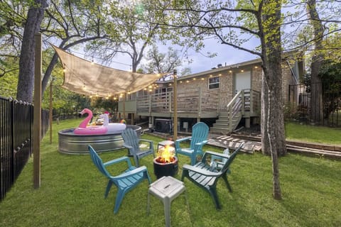 Backyard fire pit next to the cowboy pool