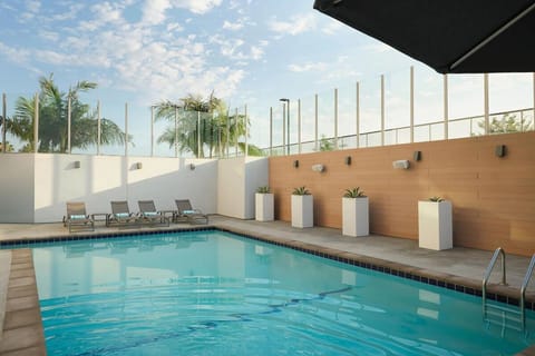 Dive into a sparkling pool for sun-soaked relaxation.