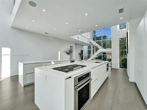 Refined culinary space showcasing sleek modern design with elegant architectural elements and seamless indoor outdoor connections