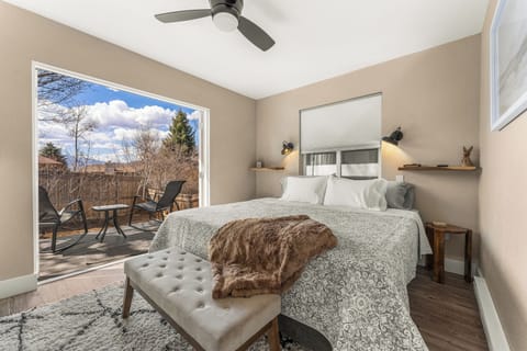 Sink into comfort in the plush king bed, with direct access to your private patio and peaceful backyard.