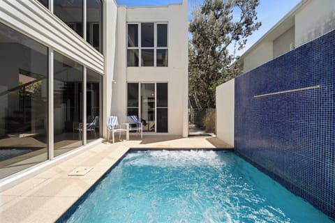 Slip into the cool plunge pool after a morning stroll or an afternoon at the beach, complete with a gentle fountain and tropical courtyard vibes.