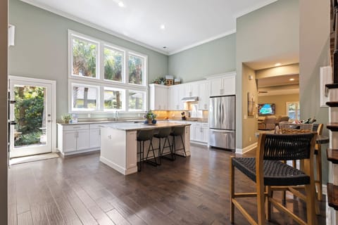 The fully-equipped kitchen is a culinary delight, boasting modern appliances, granite countertops, and all the essentials needed to prepare delicious meals.