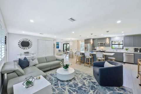 Chic furnishings and a seamless open layout create an inviting space to connect, relax, and enjoy time together