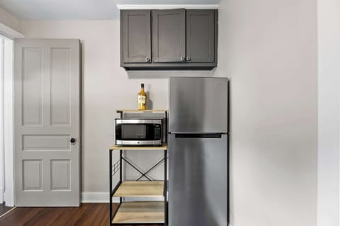 Kitchenette: Efficient & Stylish – A modern kitchenette for easy meal prep.
