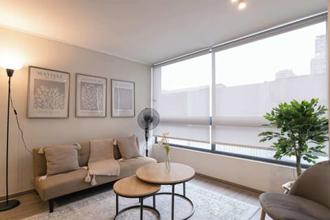 Cozy living room with stylish decor, perfect for relaxation after a day of exploring the city.