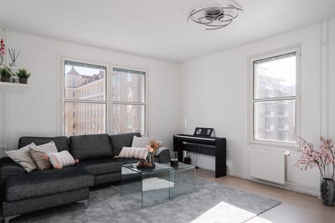 The spacious living room is perfect for relaxing after a long day of exploring the city.