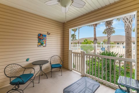 Relax on your covered balcony with bistro seating while enjoying tropical palm tree views and coastal breezes.
