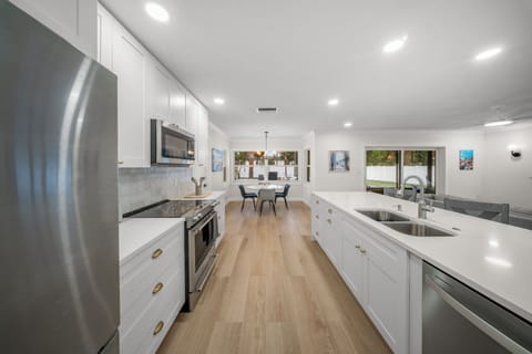 Enjoy the kitchen space with island seating, and all the cooking utensils.