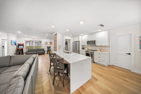 Enjoy the kitchen space with island seating, and all the cooking utensils.