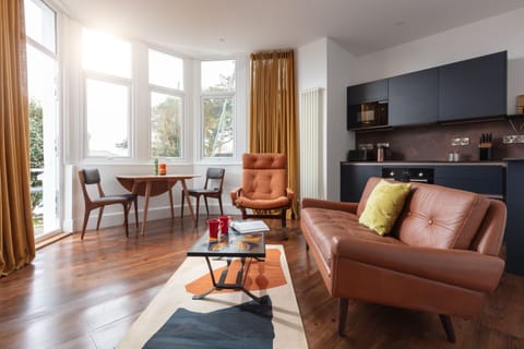 Open plan living/dining/kitchen area with direct access to terrace