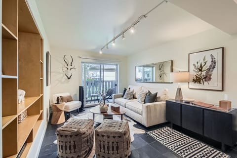 Relax in this elegant living room with Vail Mountain views through your private patio. Blackout shades ensure peaceful mornings in your prime village location - just steps to ski shuttles with world-class dining within walking distance.
