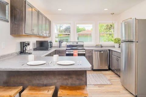 Nice sized kitchen for all your cooking needs. Includes stainless steal appliances, dishwasher, microwave, coffee pot. The kitchen is stocked with a full set of pots and pans, dishware, silverware, cooking utensils, & glass wear. The island seats 3.