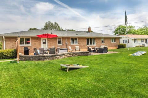 Gather your group on this inviting patio featuring shaded seating and a dining table. Step into the yard for lawn games and fresh air—ideal for shared laughs, casual meals, and quality time together.