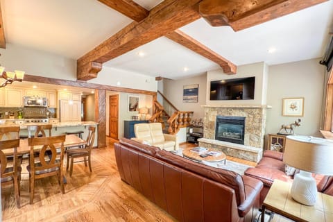 The open layout seamlessly connects the living room, dining area, and kitchen for effortless entertaining and quality time together.