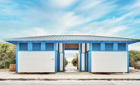 Beach access restrooms, shower station, 115 parking spots
