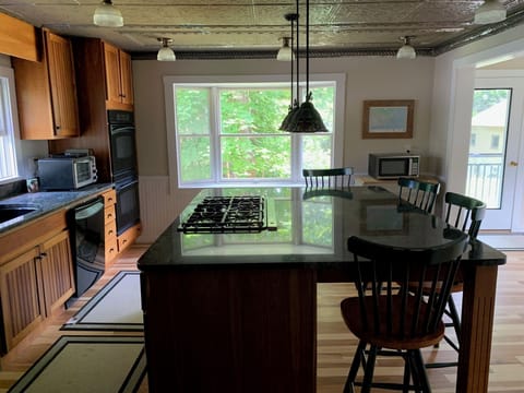 Kitchen area, marble countertops, gas cooktop