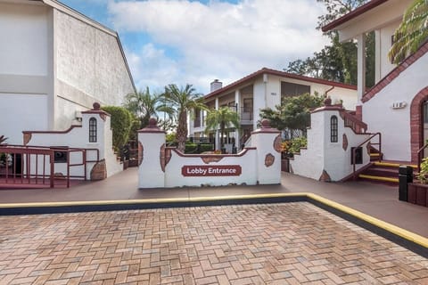 Arrive with ease at a welcoming, palm-lined lobby entrance.