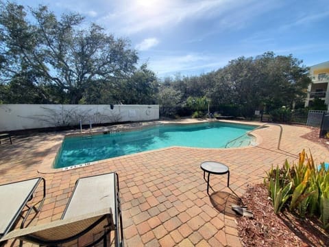 Inviting outdoor pool with lounge chairs, perfect for a sunny relaxation day.