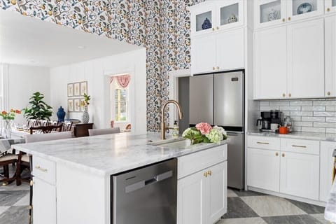 Spacious kitchen perfect for morning coffee & group meals.