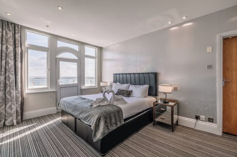 Wake up to sunshine and calming coastal views from bed.