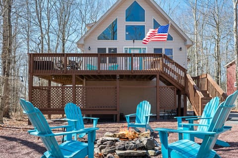 Gather around the stone fire pit and soak in the fresh mountain air at this cozy chalet.