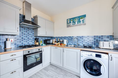 The kitchen is fully equipped with all the essentials you need to prepare and enjoy a home-cooked meal during your stay.