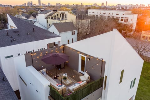 Host outdoor dinners or catch sunsets on your spacious rooftop terrace with dining set.