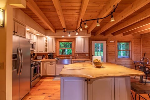 Customized Kitchen with Stainless Appliances and Hand-Crafted Live Edge Wood Counters