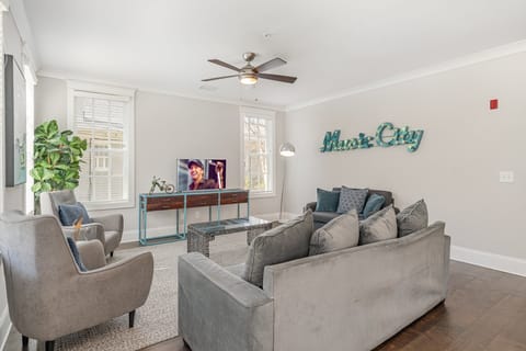 Unit 1 (1st Floor): Open and inviting living space featuring a Smart TV and cozy furnishings.