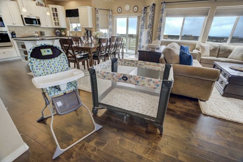 Family-friendly amenities include a high chair and a pack-n-play, ensuring comfort and convenience for guests traveling with little ones. The open layout makes it easy to keep an eye on the family while enjoying the spacious living area!