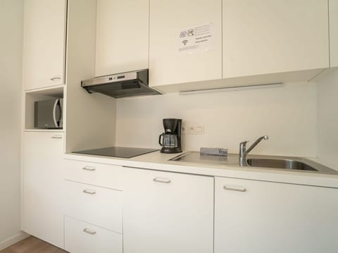 Interior Design, Countertop, Cabinetry, Kitchen, Flooring, Kitchen Sink, Kitchen Appliance, Floor, Sink, Furniture