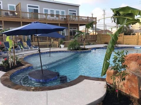 Our pool features a swim up bar and table top for additional seating and a tanning ledge.