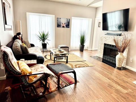 Spacious living room flooded with natural light featuring an open-concept design