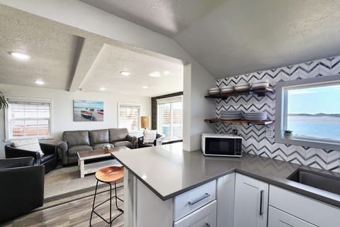 The cook is part of the group in the living room!