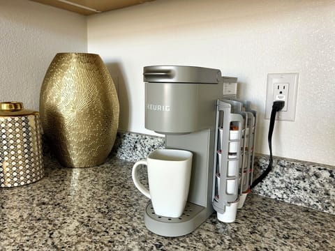 Keurig machine with K-cups and mugs provided
