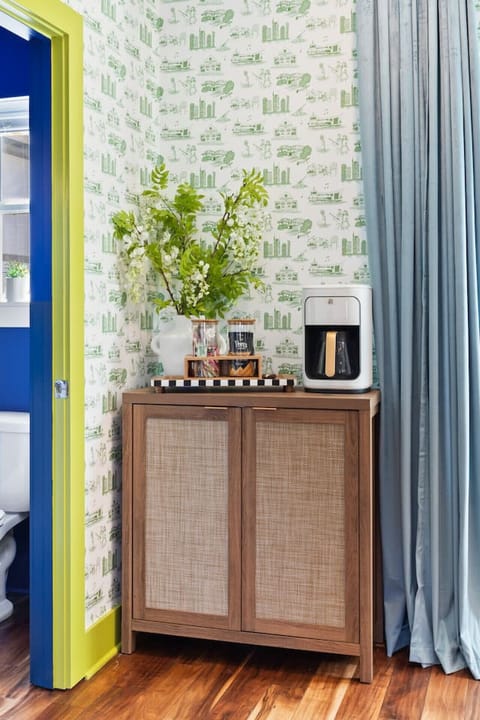 Open floor plan from the kitchen to living room, equipped with comfortable furnishings, plenty of natural light and all the kitchen essentials you would need. Seating at our dining table and the kitchen island.