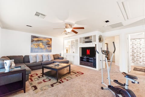 Relax, entertain, and exercise: a multi-purpose room for modern living.