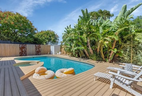 Pool view with deck and outdoor shower 
