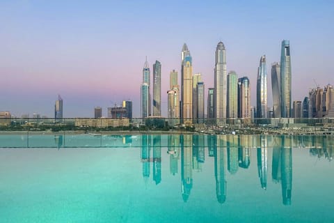 Infinity Pool View: Dive into luxury with stunning skyline reflections at sunset!