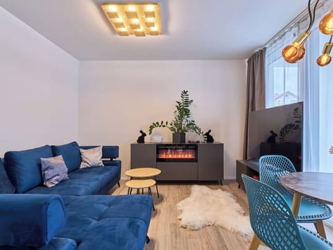 Furniture, Interior Design, Flooring, Couch, Wall, Floor, Living Room, Wood, Ceiling, Light Fixture