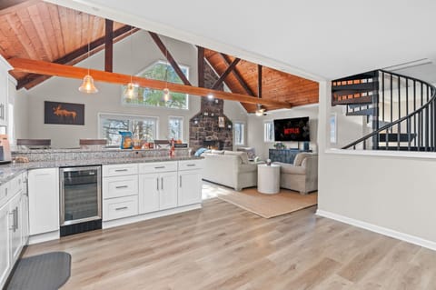 Chef’s Dream Kitchen
Cook, chat, and gather in this wide-open kitchen featuring stainless steel appliances and a view into the heart of the home.