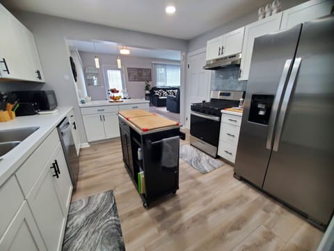 Full kitchen with island. All new appliances, basic spices and condiments.