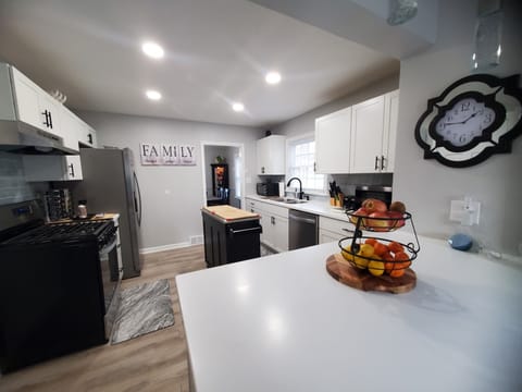 Full kitchen with island. All new appliances, basic spices and condiments
