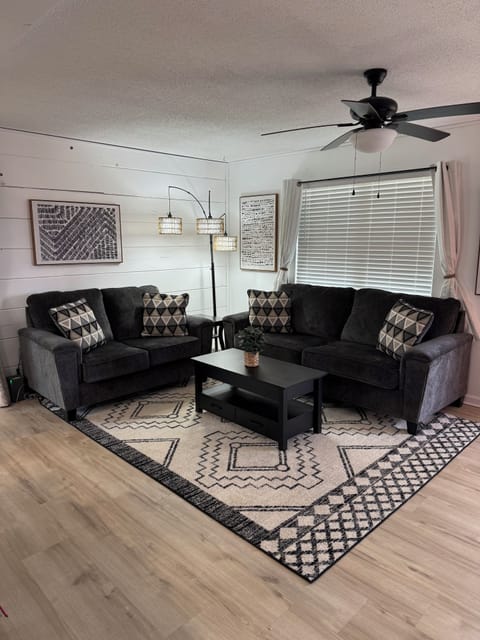 Large comfortable living room with flat screen TV.