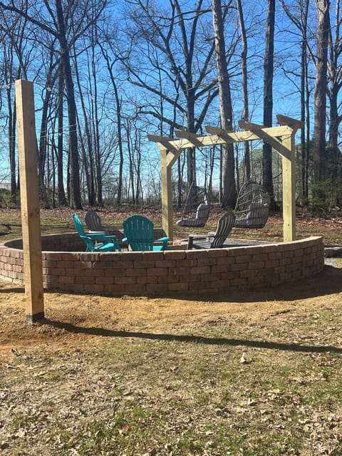 Beautiful outdoor firepit with lights for enjoying after dark.