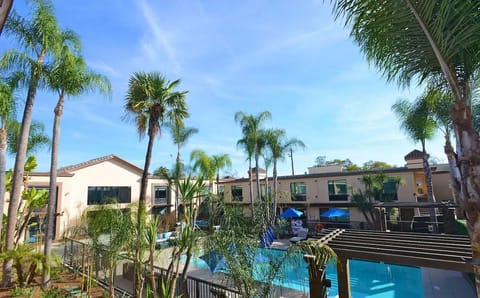 Take in the resort-style grounds framed by swaying palms.